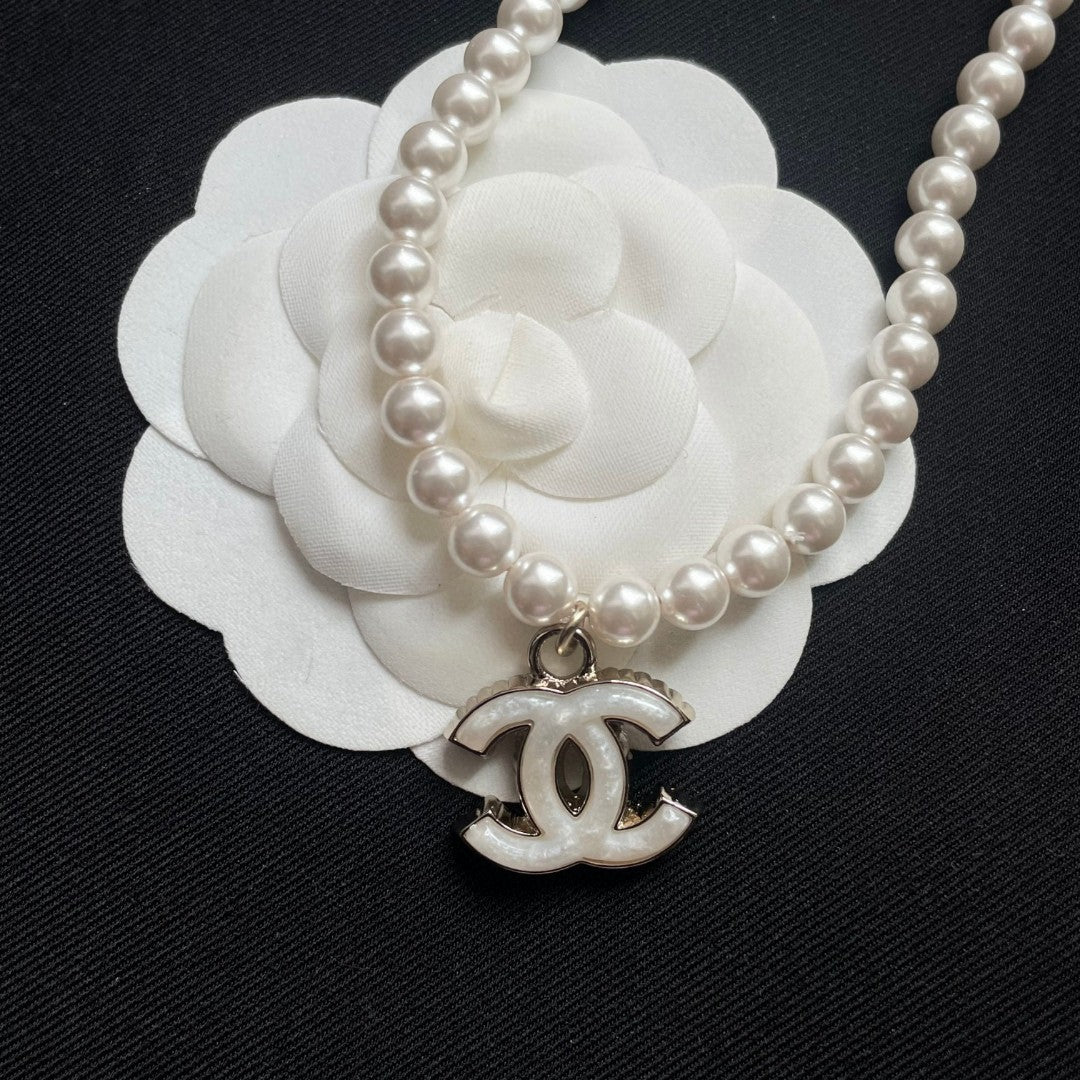 Double-C Emblem Pearl-Detail Pendant Necklace – Pearl Detail – Design 123 styled product view