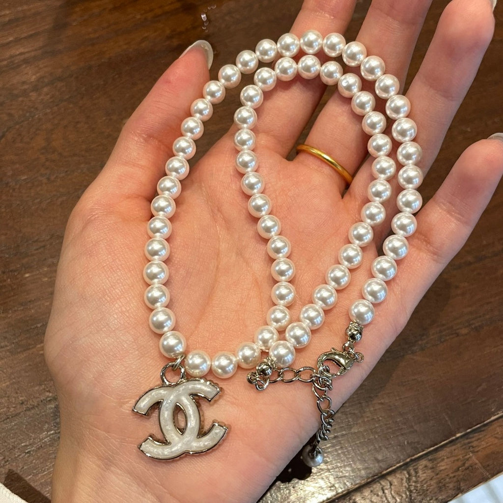 Double-C Emblem Pearl-Detail Pendant Necklace – Pearl Detail – Design 123 detail view