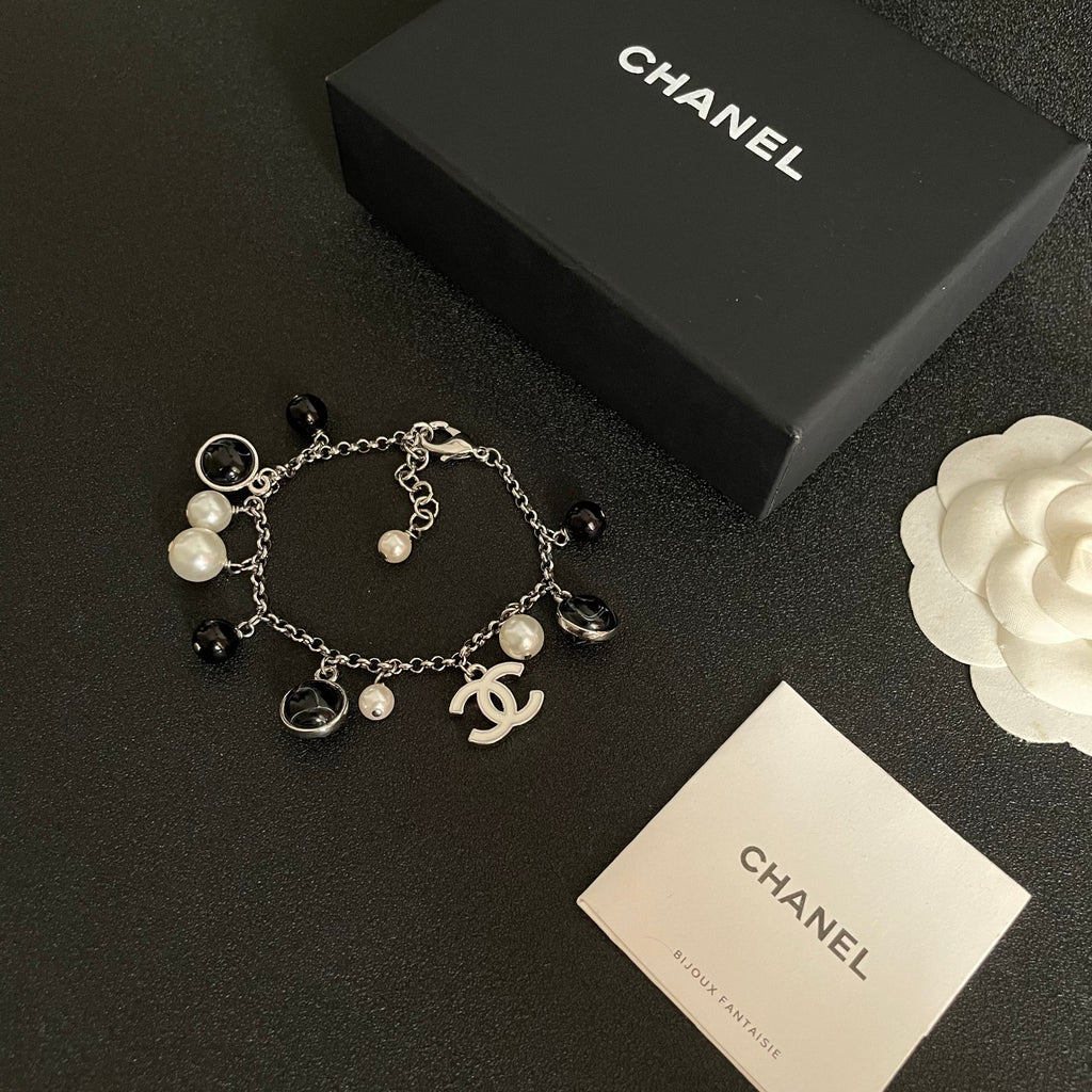 Signature Emblem Bracelet in Polished Metal-Tone – Black Detail – Design 003 close-up detail