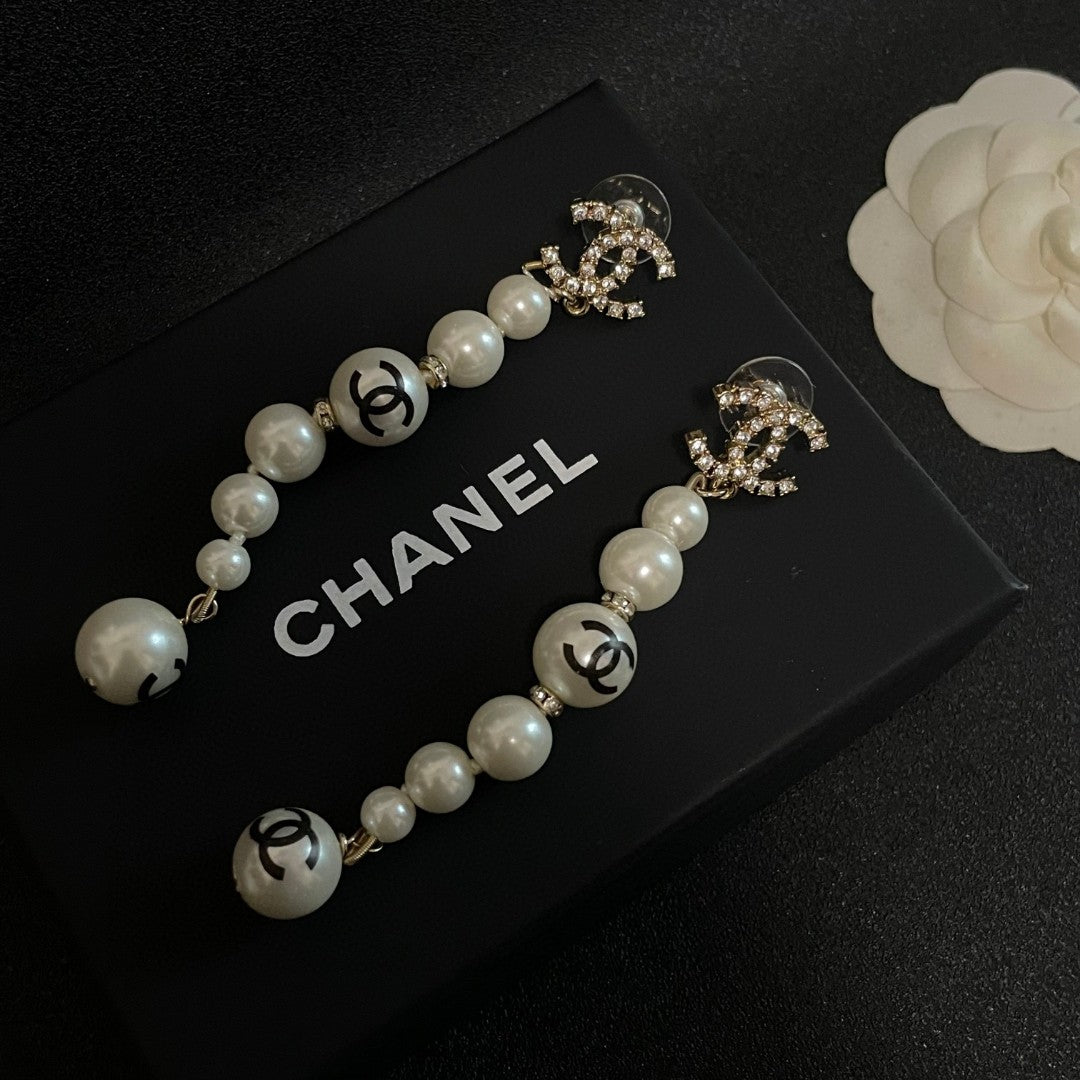 Double-C Emblem Pearl-Detail Statement Earrings – Pearl Detail – Design 028 detail view