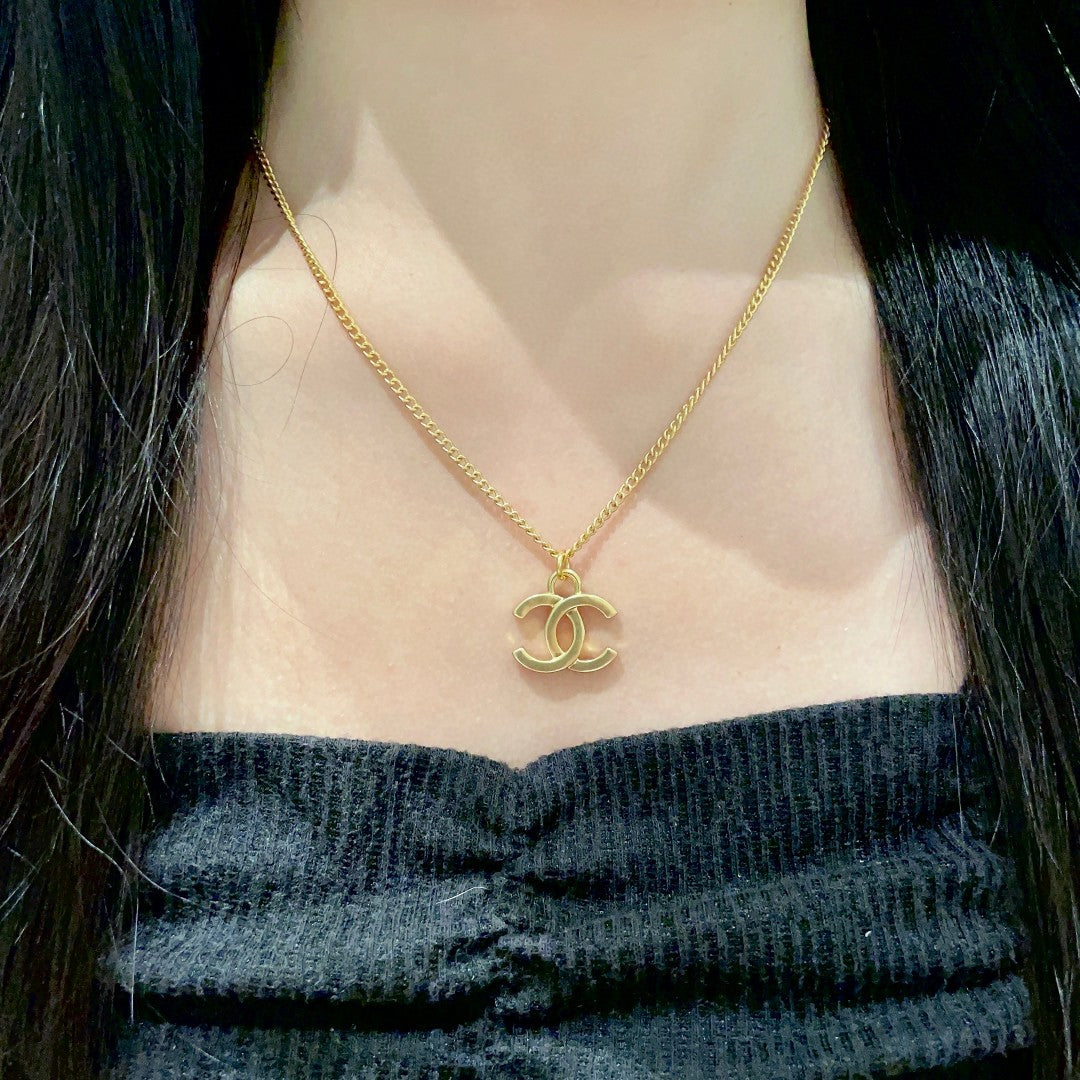 Double-C Emblem Pendant Necklace in Polished Metal-Tone – Design 072 detail view