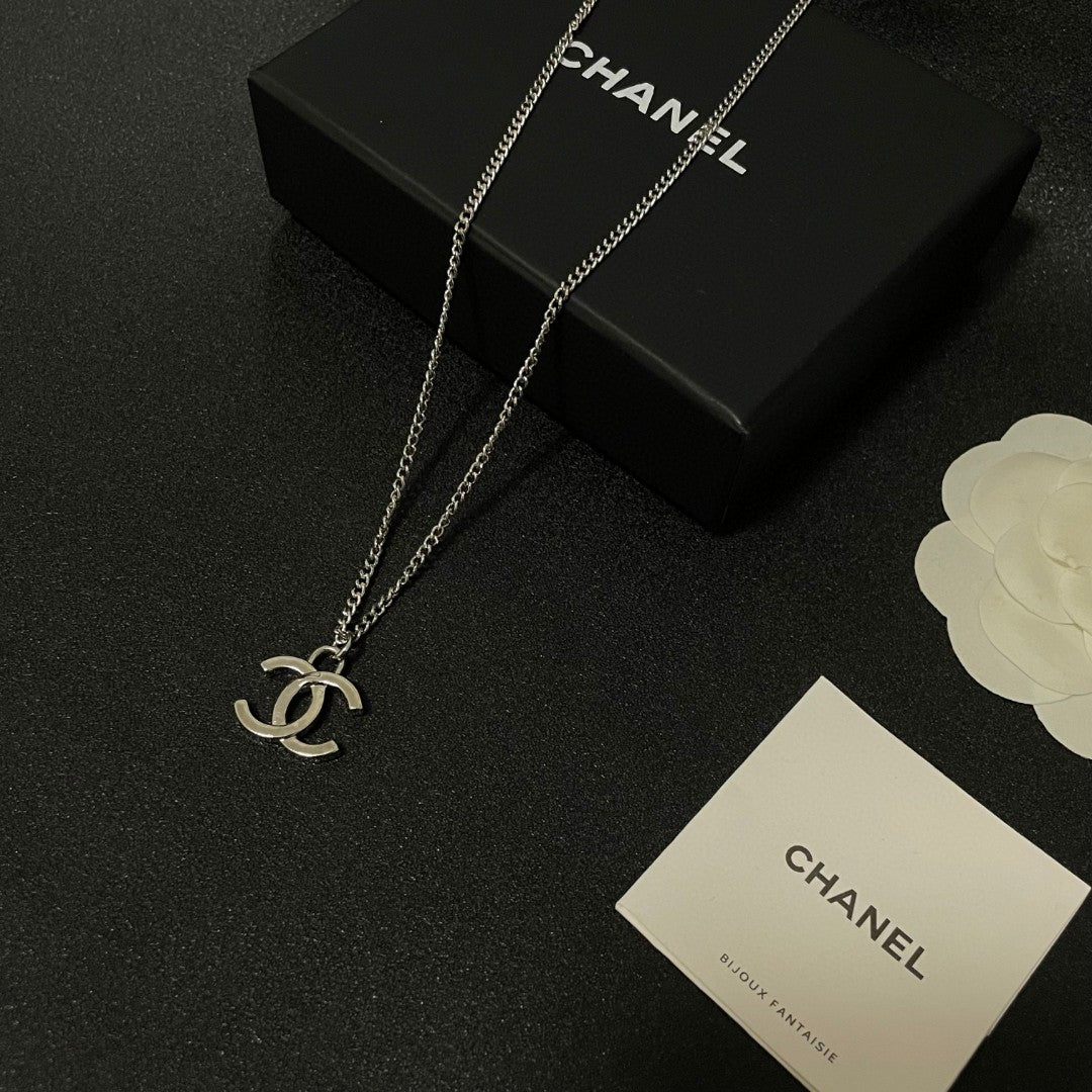 Double-C Emblem Pendant Necklace in Polished Metal-Tone – Design 071 close-up detail