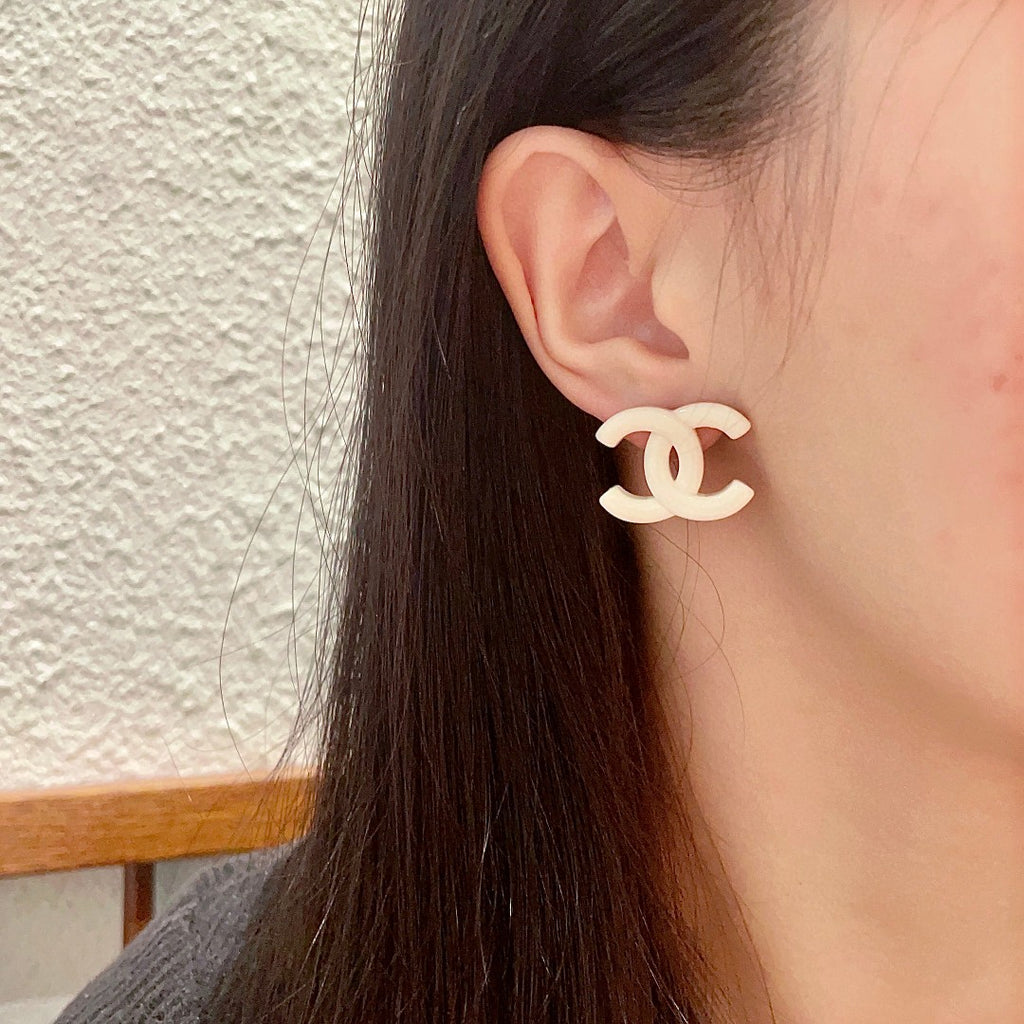 Double-C Emblem Stud Earrings in Polished Metal-Tone – Design 363 detail view