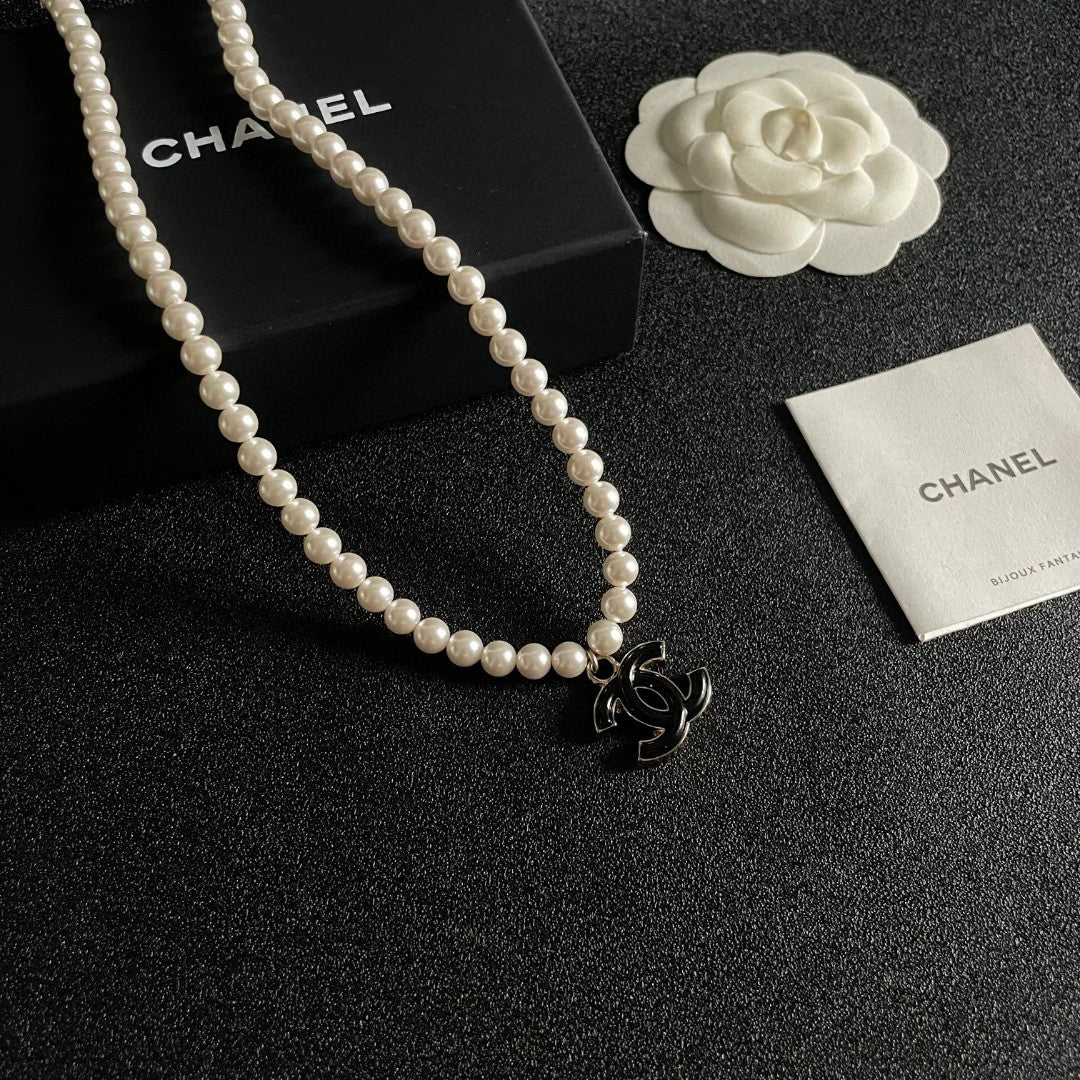 Double-C Emblem Pearl-Detail Pendant Necklace – Pearl Detail – Design 108 styled product view