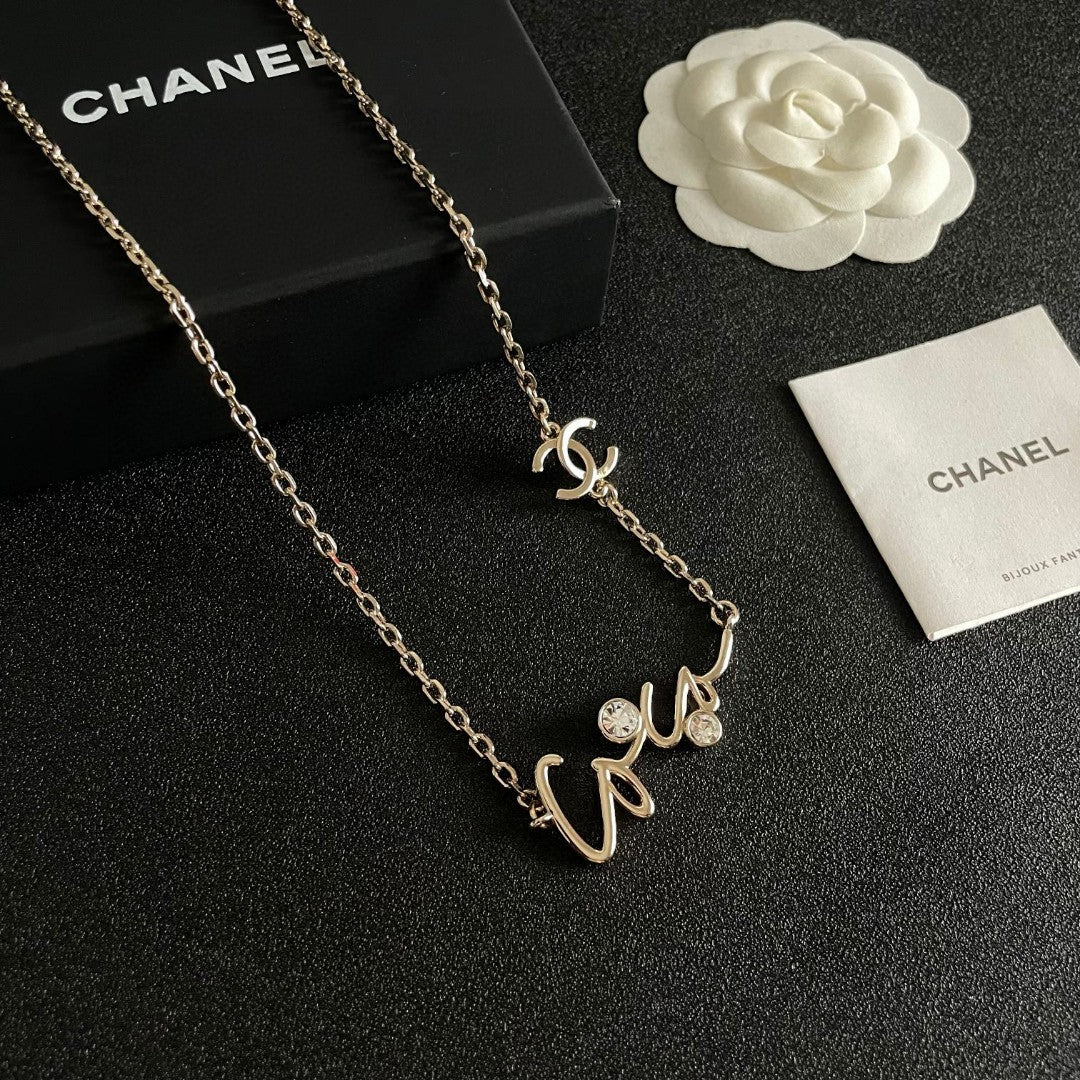 Double-C Emblem Pendant Necklace in Polished Metal-Tone – Design 062 close-up detail