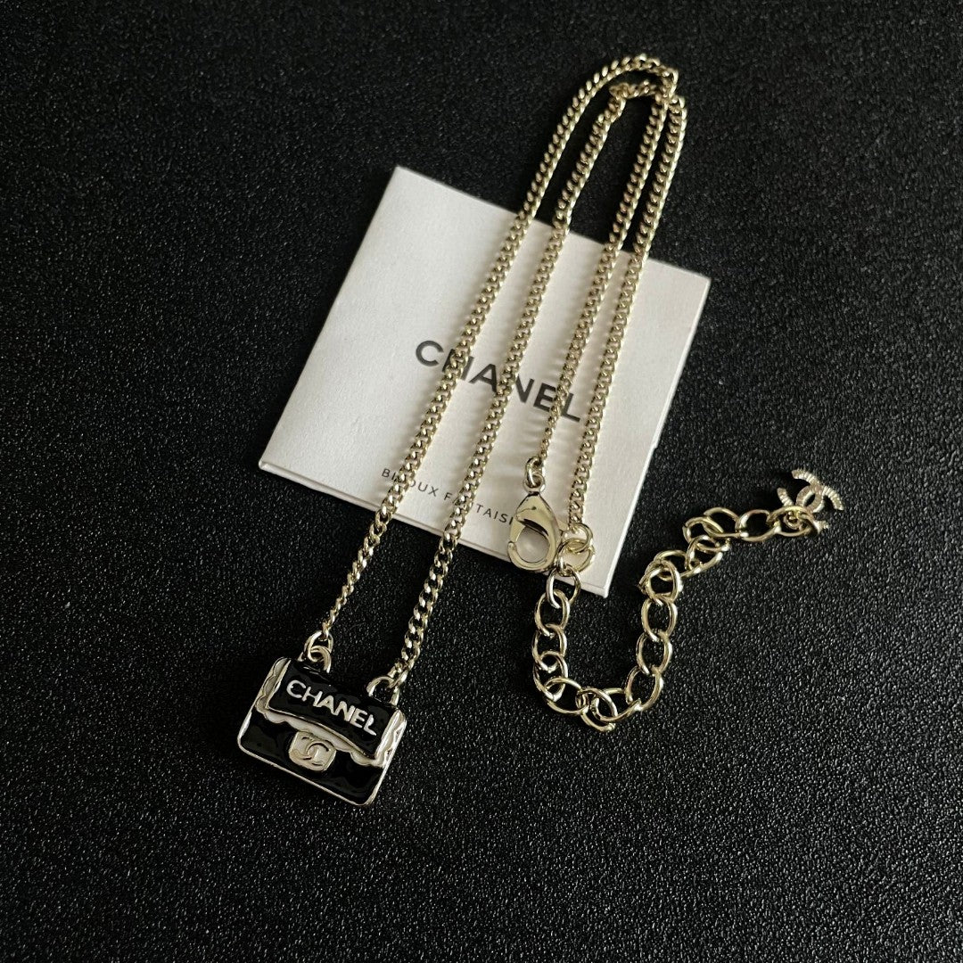 Double-C Emblem Pendant Necklace in Polished Metal-Tone – Design 056 close-up detail