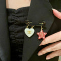 Double-C Emblem Brooch in Polished Metal-Tone – Star Detail main product view