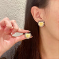 Double-C Emblem Pearl-Detail Stud Earrings – Pearl Detail – Design 019 main product view