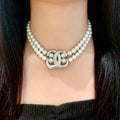 Double-C Emblem Pearl-Detail Pendant Necklace – Pearl Detail – Design 075 main product view