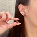 Double-C Emblem Stud Earrings in Polished Metal-Tone – Design 296 main product view