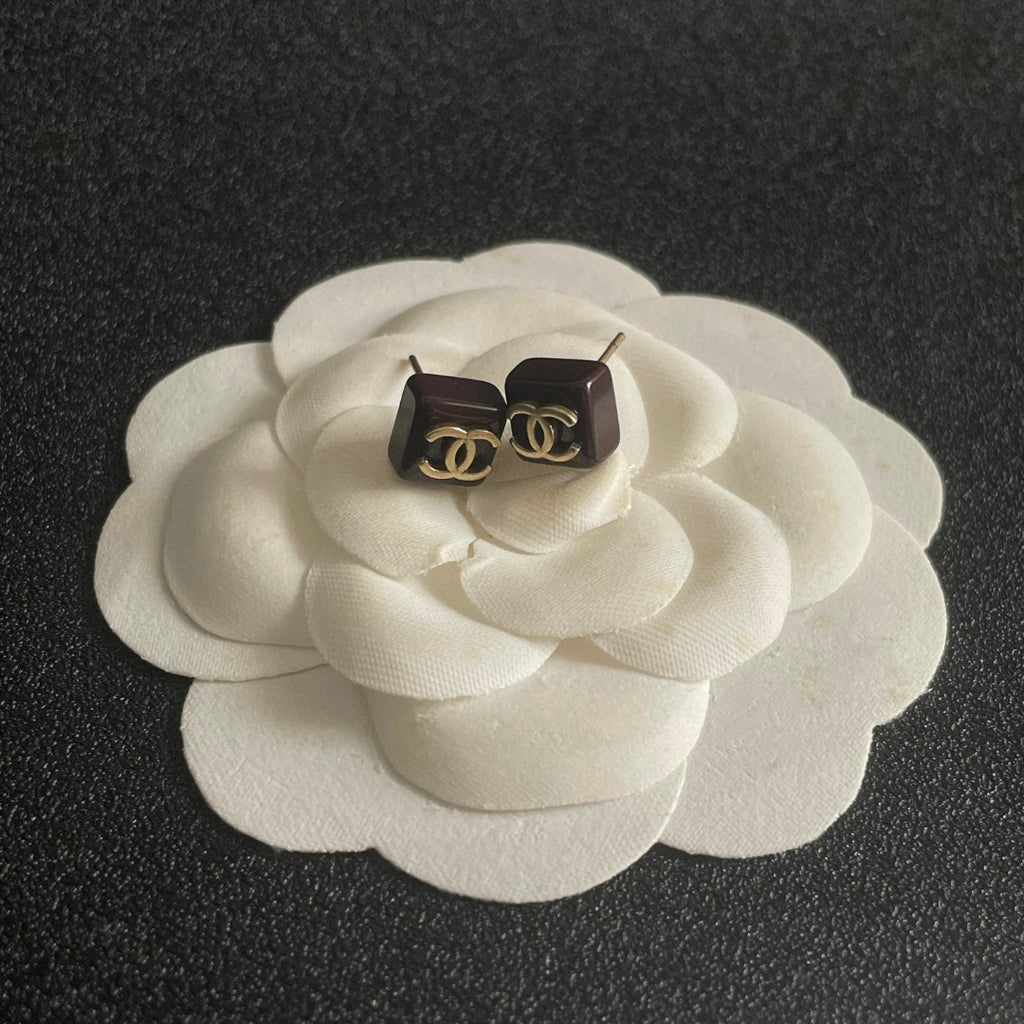 Double-C Emblem Stud Earrings in Polished Metal-Tone – Design 296 front product view