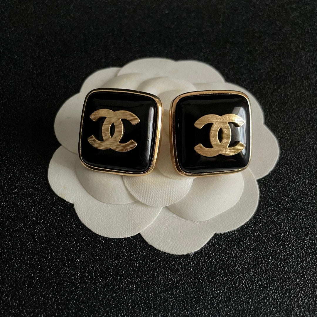 Double-C Emblem Stud Earrings in Polished Metal-Tone – Design 295 front product view