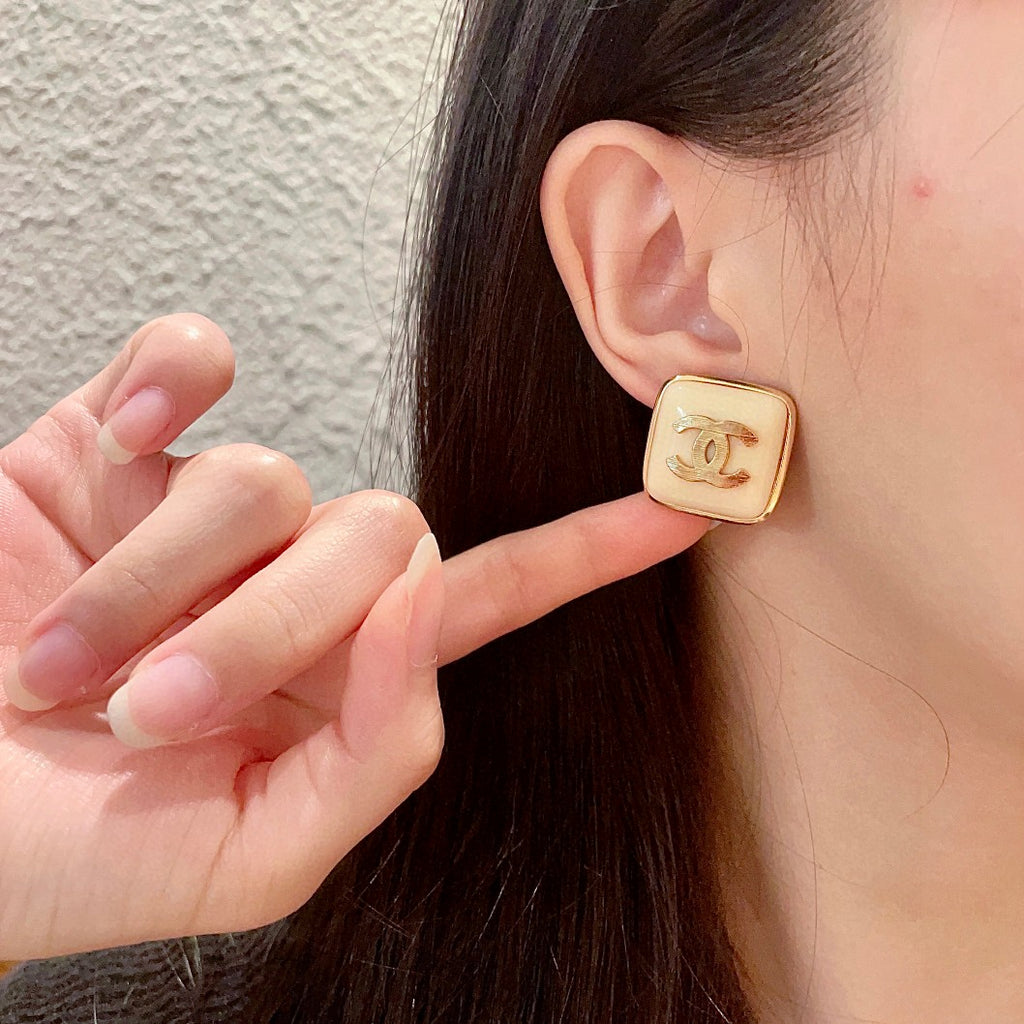 Double-C Emblem Stud Earrings in Polished Metal-Tone – Design 294 front product view