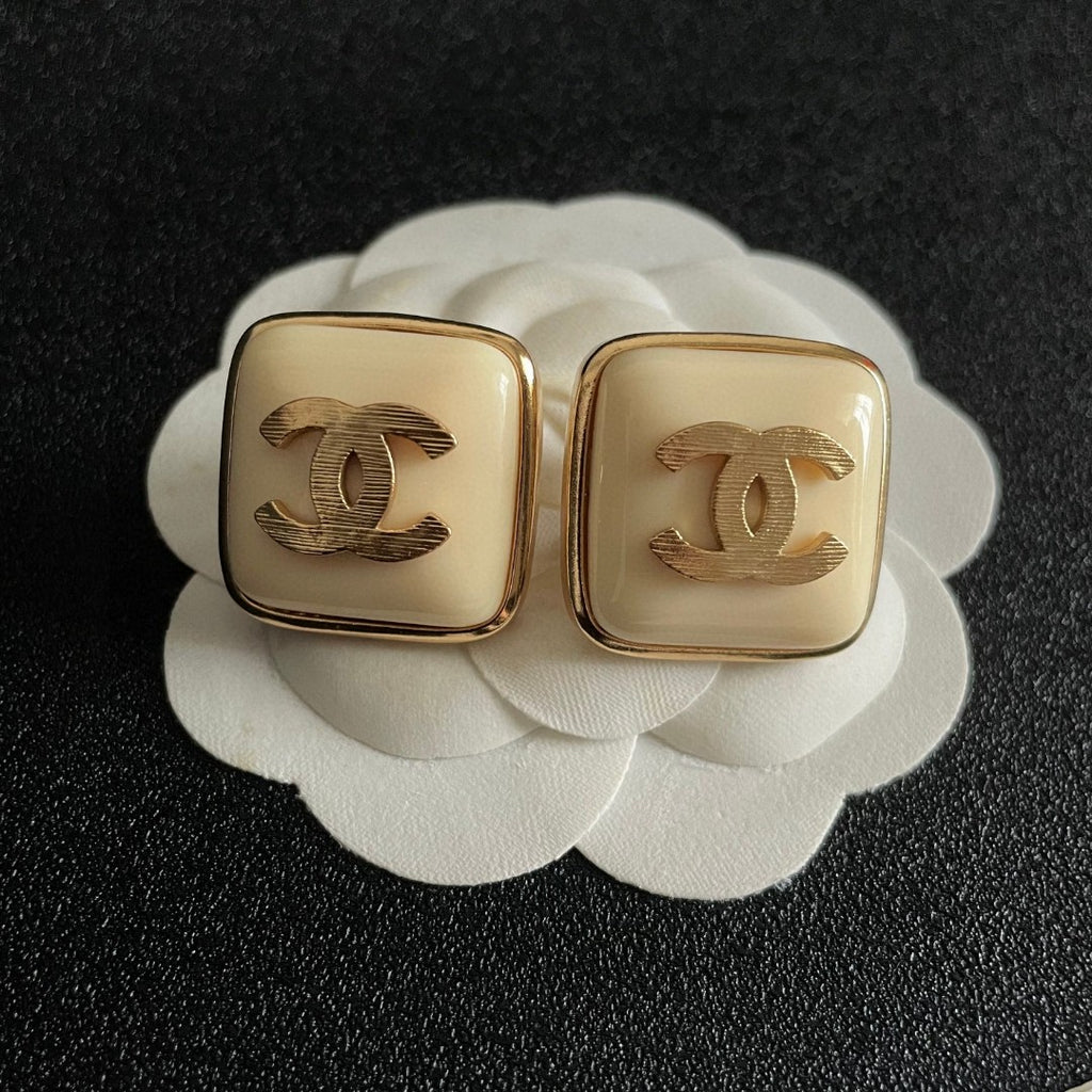 Double-C Emblem Stud Earrings in Polished Metal-Tone – Design 294 front product view