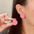 Double-C Emblem Stud Earrings in Polished Metal-Tone – Pink Detail main product view