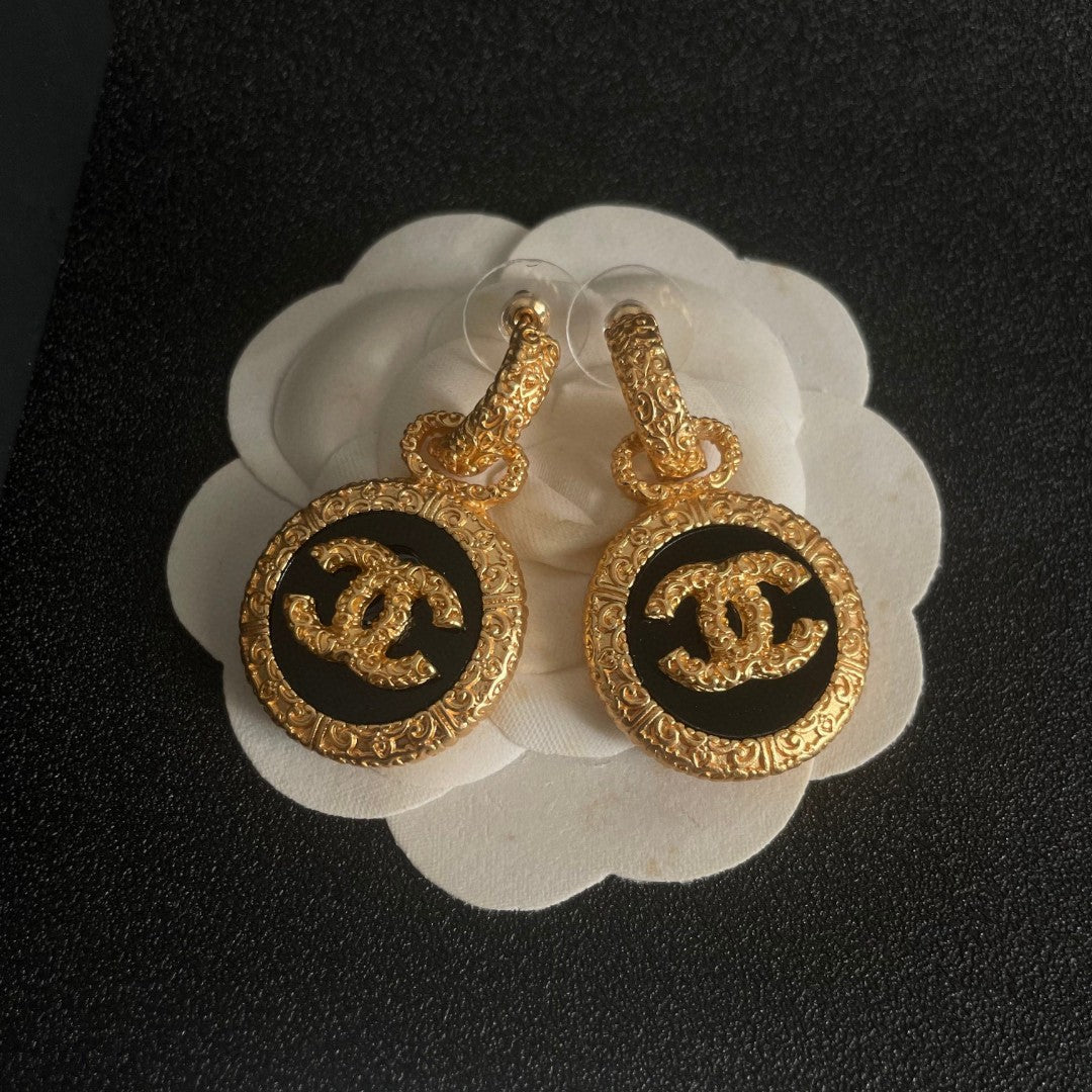 Double-C Emblem Stud Earrings in Polished Metal-Tone – Design 242 front product view