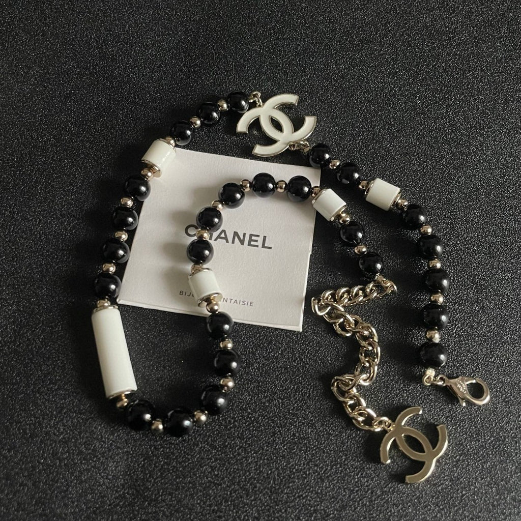Double-C Emblem Pendant Necklace in Polished Metal-Tone – Black Detail detail view