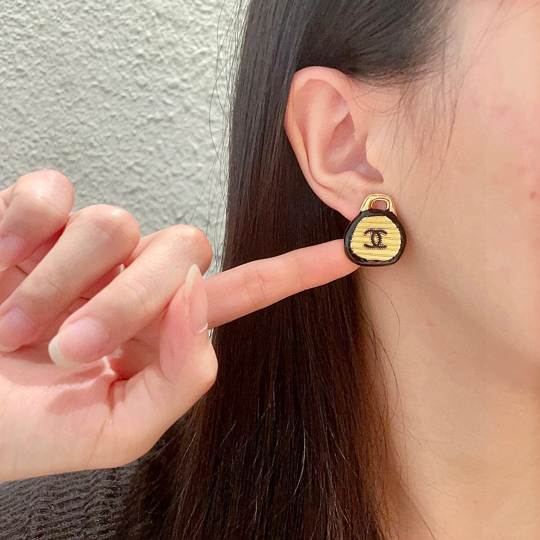 Double-C Emblem Stud Earrings in Polished Metal-Tone – Design 199 front product view