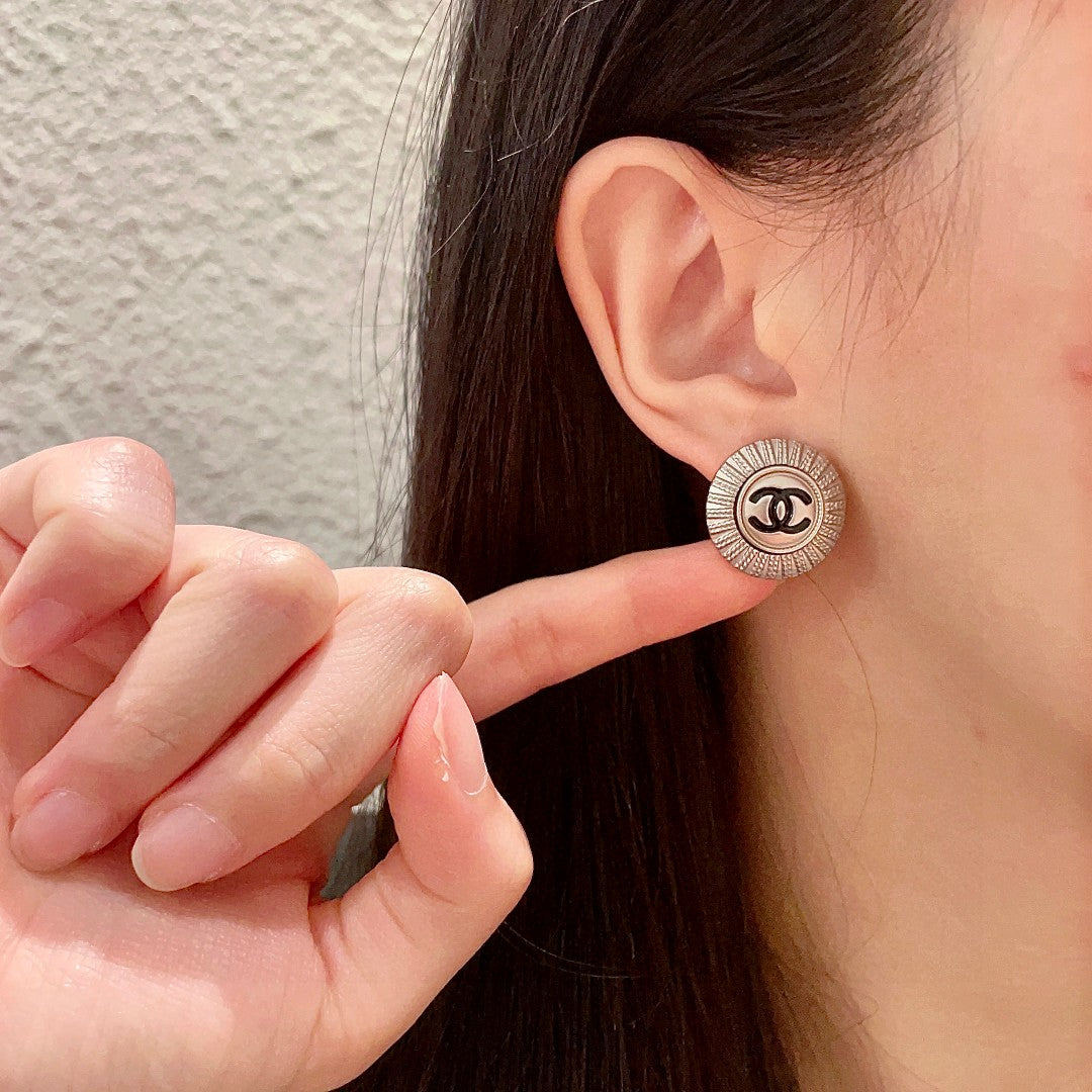 Double-C Emblem Stud Earrings in Polished Metal-Tone – Design 196 front product view