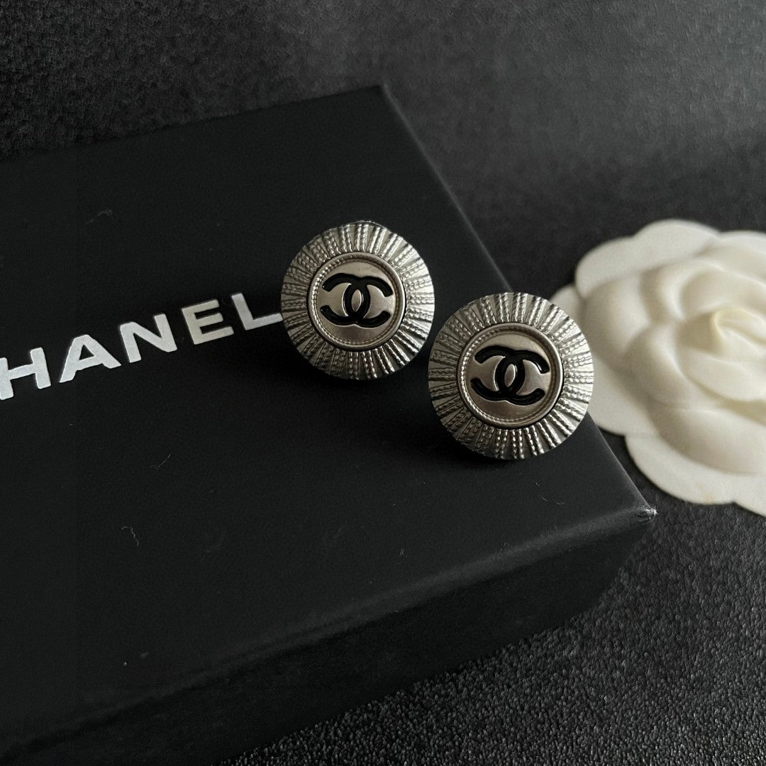 Double-C Emblem Stud Earrings in Polished Metal-Tone – Design 196 detail view