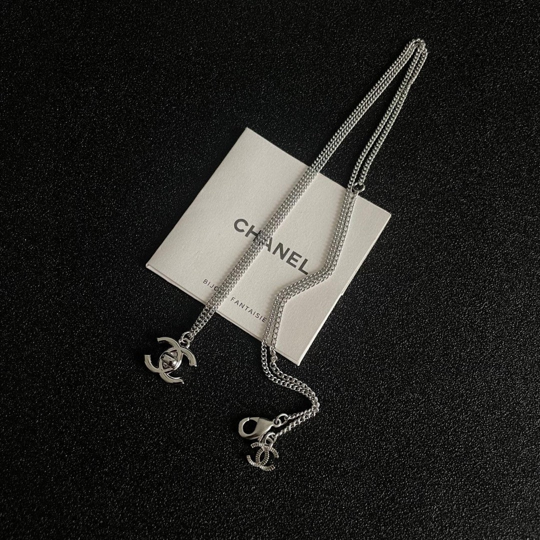 Double-C Emblem Pendant Necklace in Polished Metal-Tone – Design 025 detail view