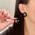 Double-C Emblem Stud Earrings in Polished Metal-Tone – Design 193 main product view