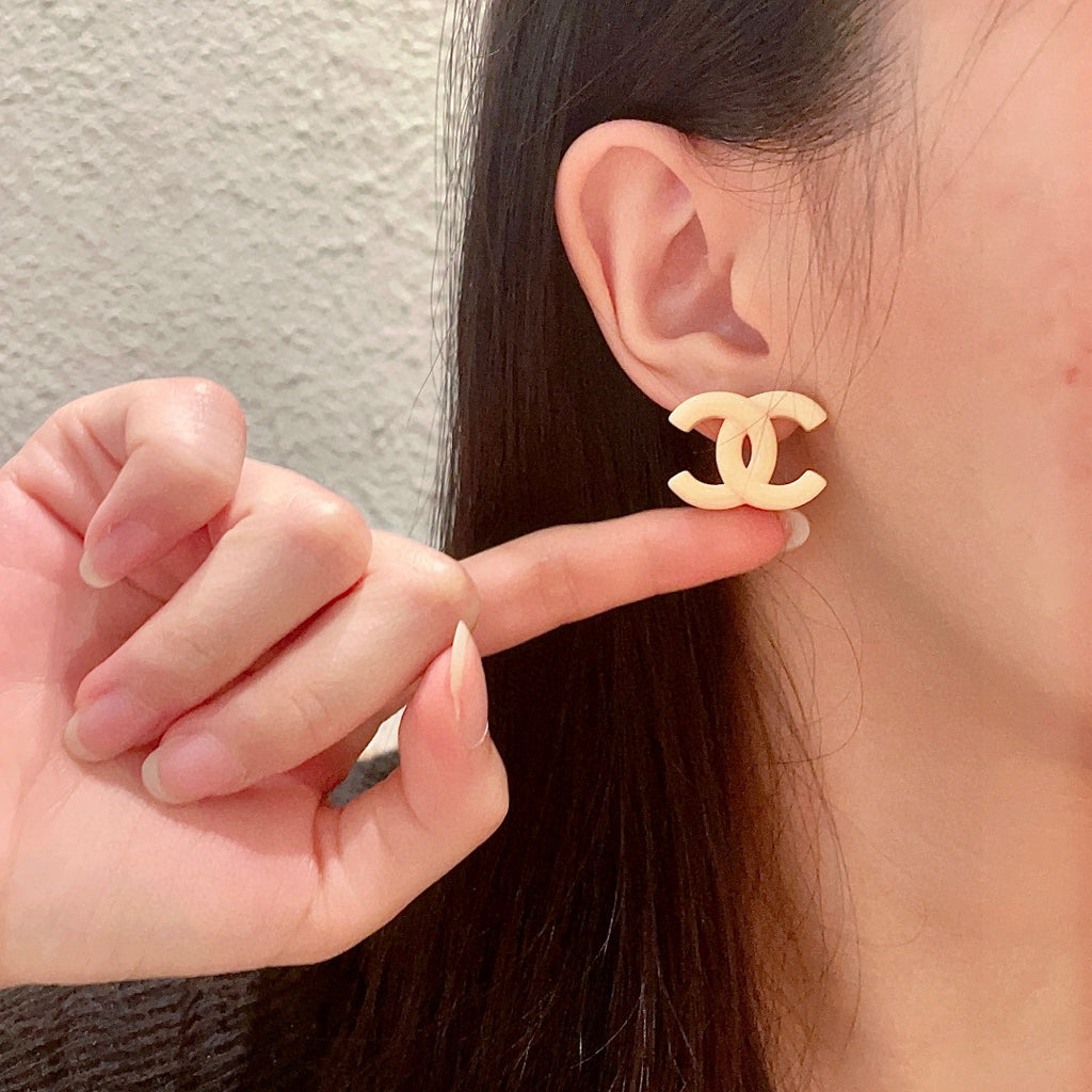 Double-C Emblem Stud Earrings in Polished Metal-Tone – Design 157 front product view
