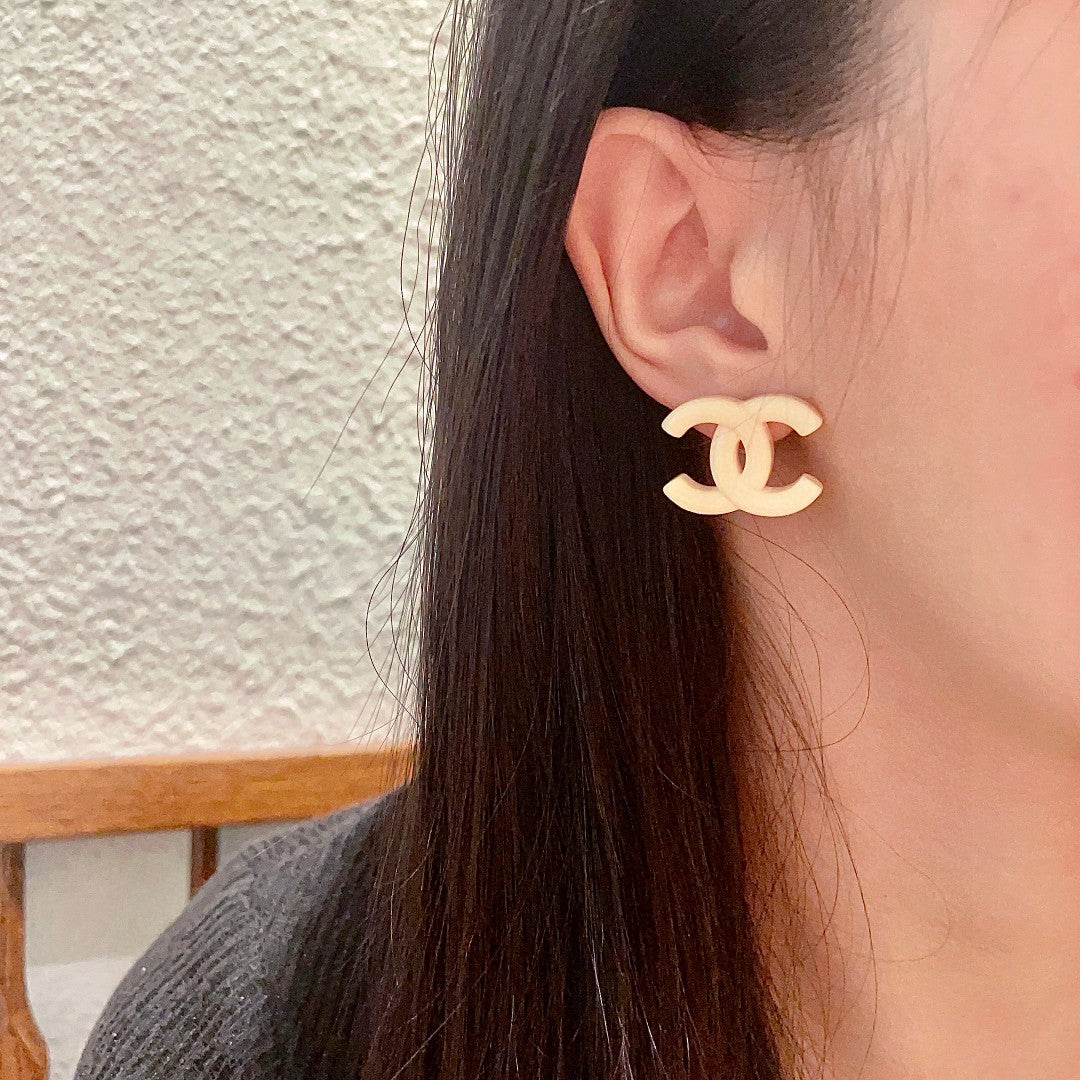 Double-C Emblem Stud Earrings in Polished Metal-Tone – Design 157 detail view