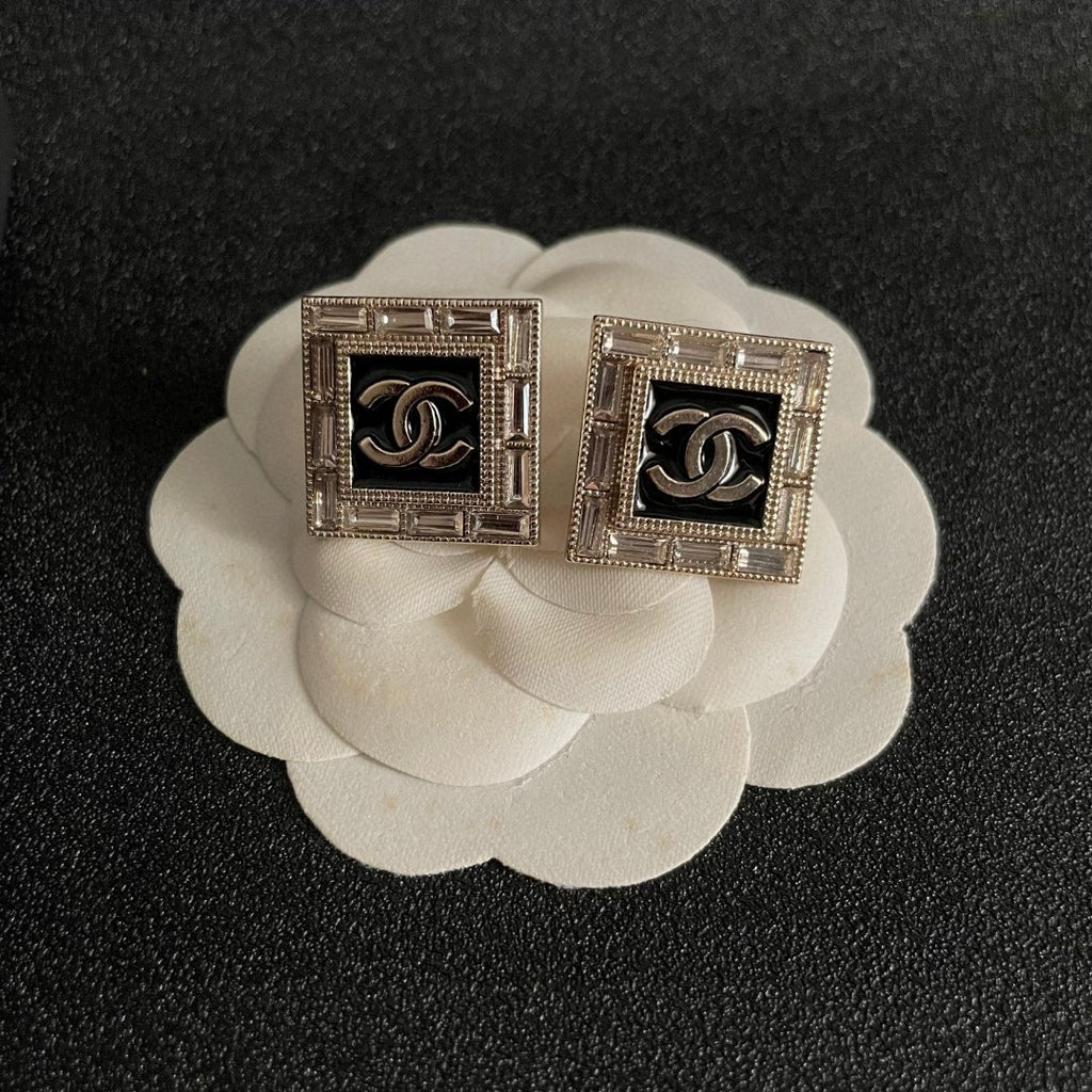 Double-C Emblem Stud Earrings in Polished Metal-Tone – Design 148 front product view