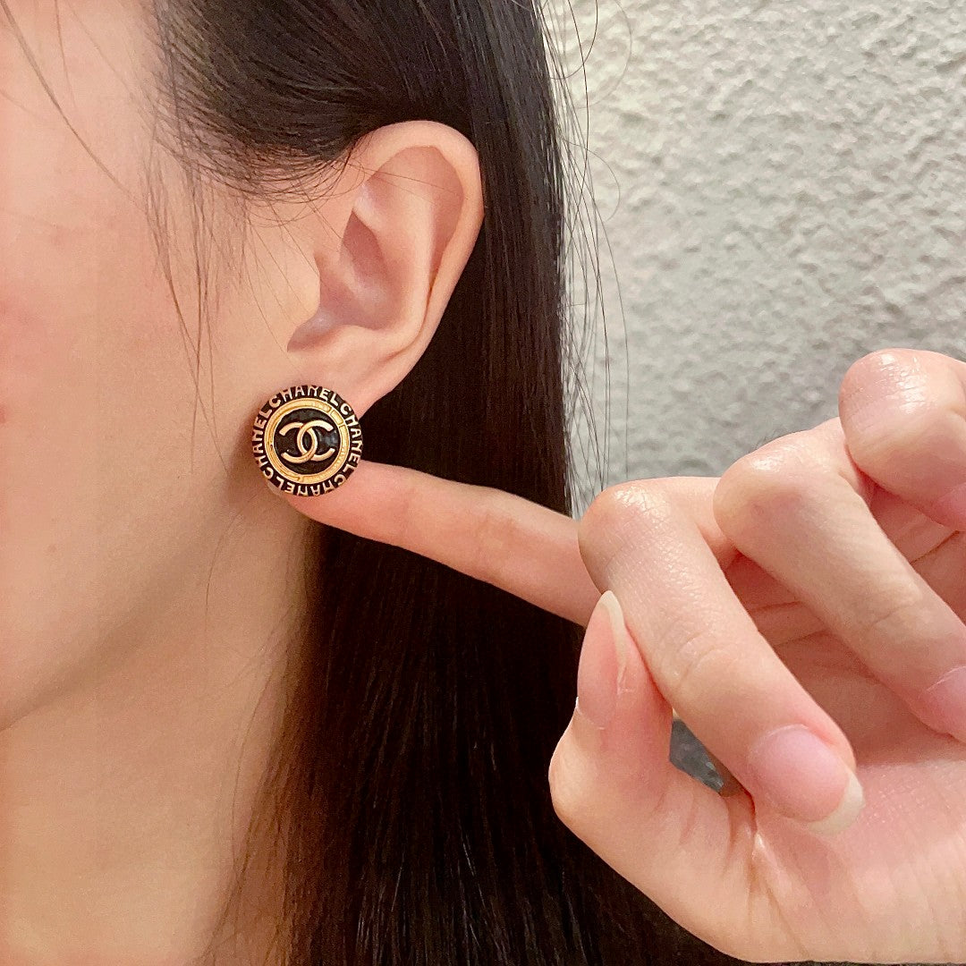 Double-C Emblem Stud Earrings in Polished Metal-Tone – Design 144 front product view