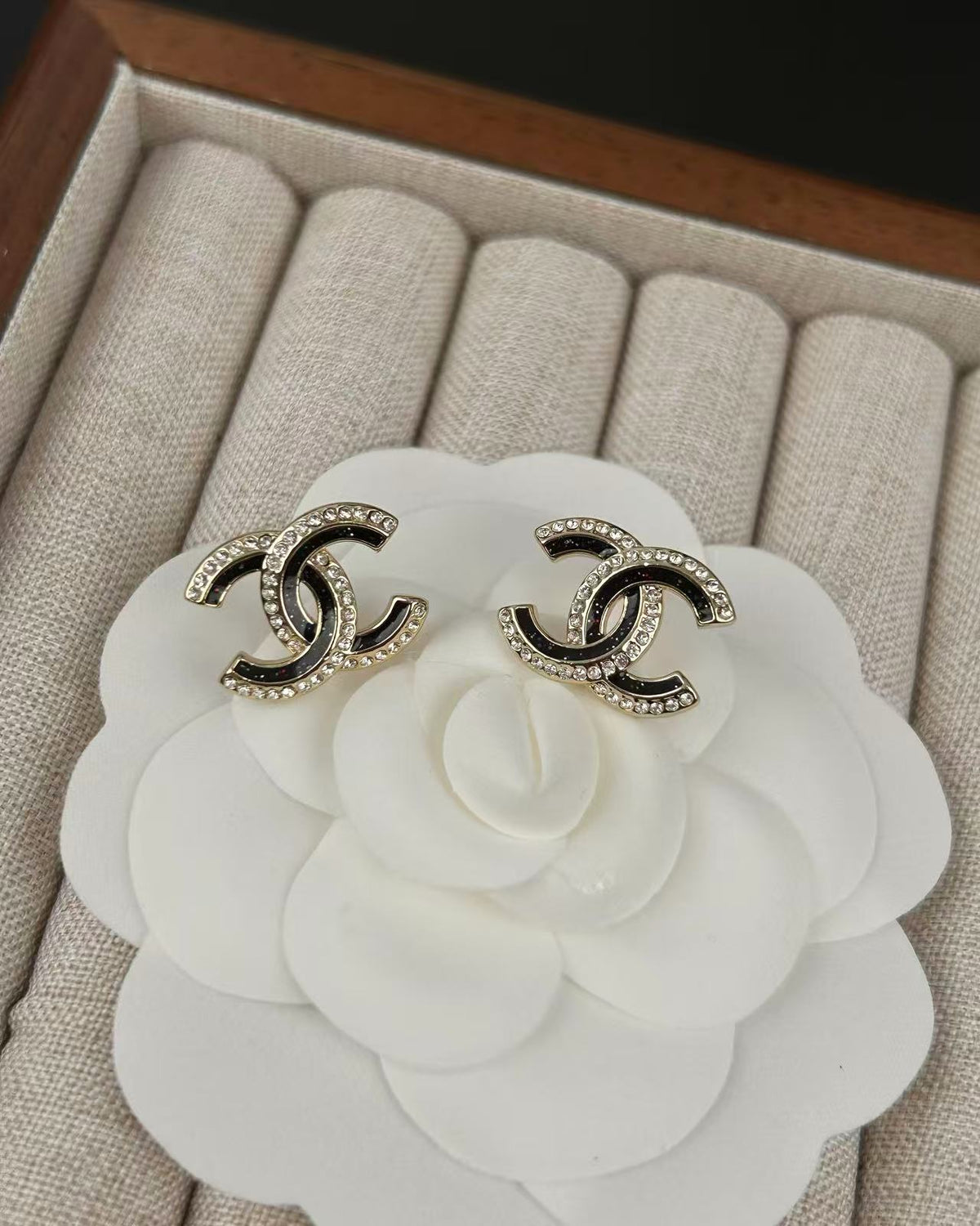 Signature Emblem Crystal-Accent Stud Earrings – Black Detail close-up detail