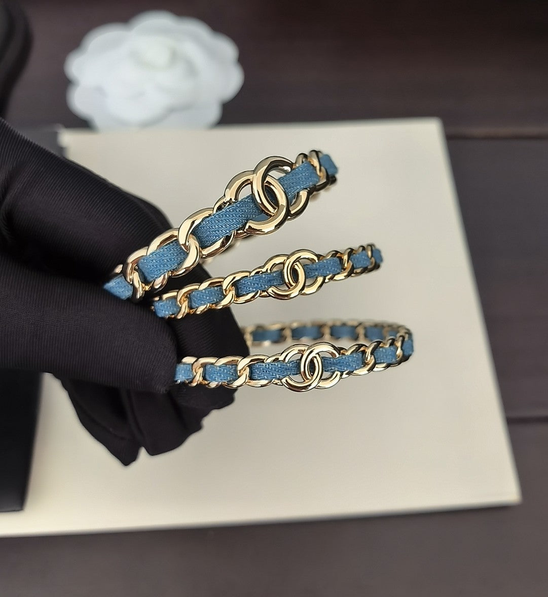 Signature Emblem Bangle in Gold-Tone – Blue Detail main product view