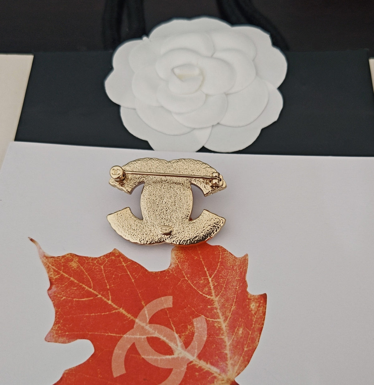 Signature Emblem Brooch in Gold-Tone – Pink Detail front product view
