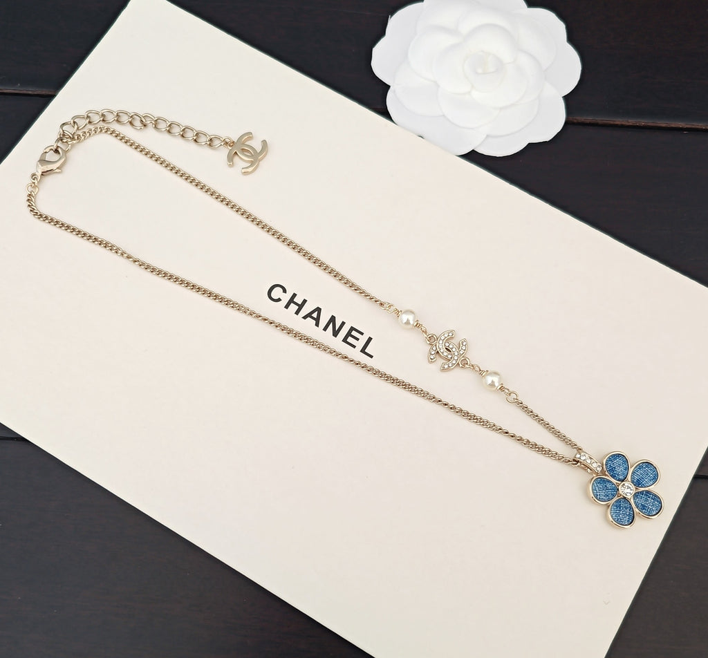 Signature Emblem Crystal-Accent Pendant Necklace – Blue Detail close-up detail