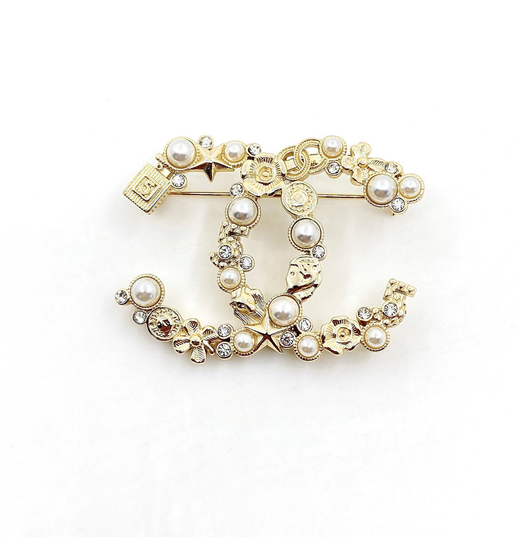 Signature Emblem Brooch in Polished Metal-Tone – Design 019 close-up detail