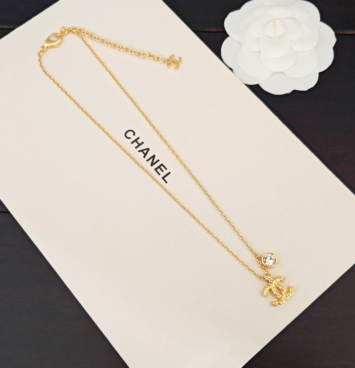 Signature Emblem Crystal-Accent Pendant Necklace – White Detail – Design 004 close-up detail