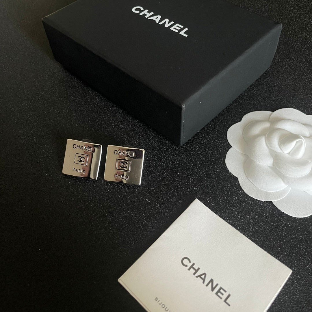 Double-C Emblem Stud Earrings in Polished Metal-Tone – Design 265 close-up detail