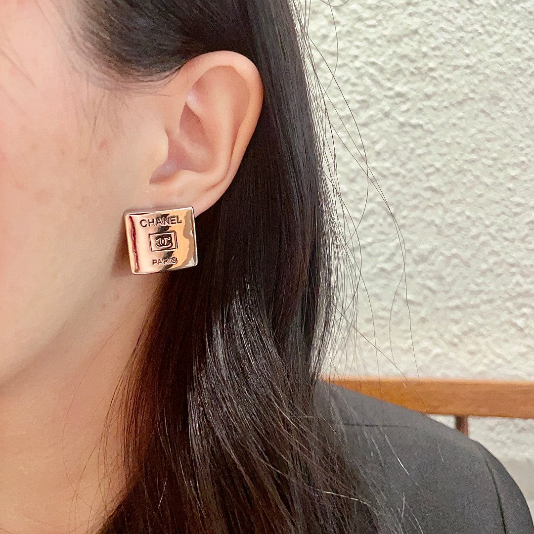 Double-C Emblem Stud Earrings in Polished Metal-Tone – Design 253 detail view