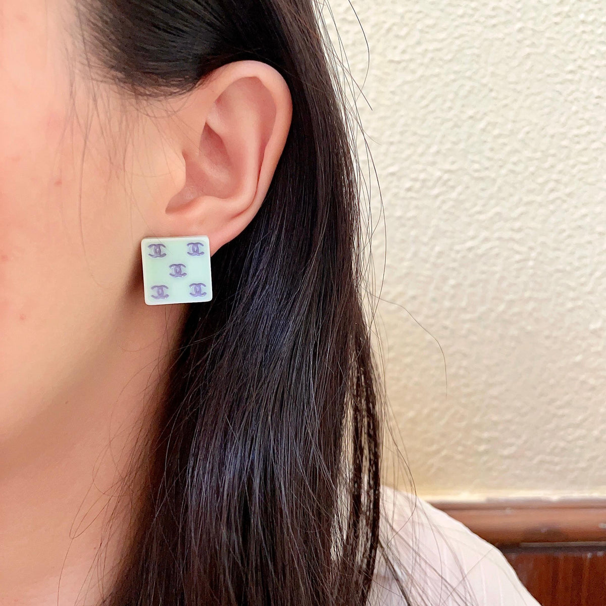 Double-C Emblem Stud Earrings in Polished Metal-Tone – Design 230 detail view