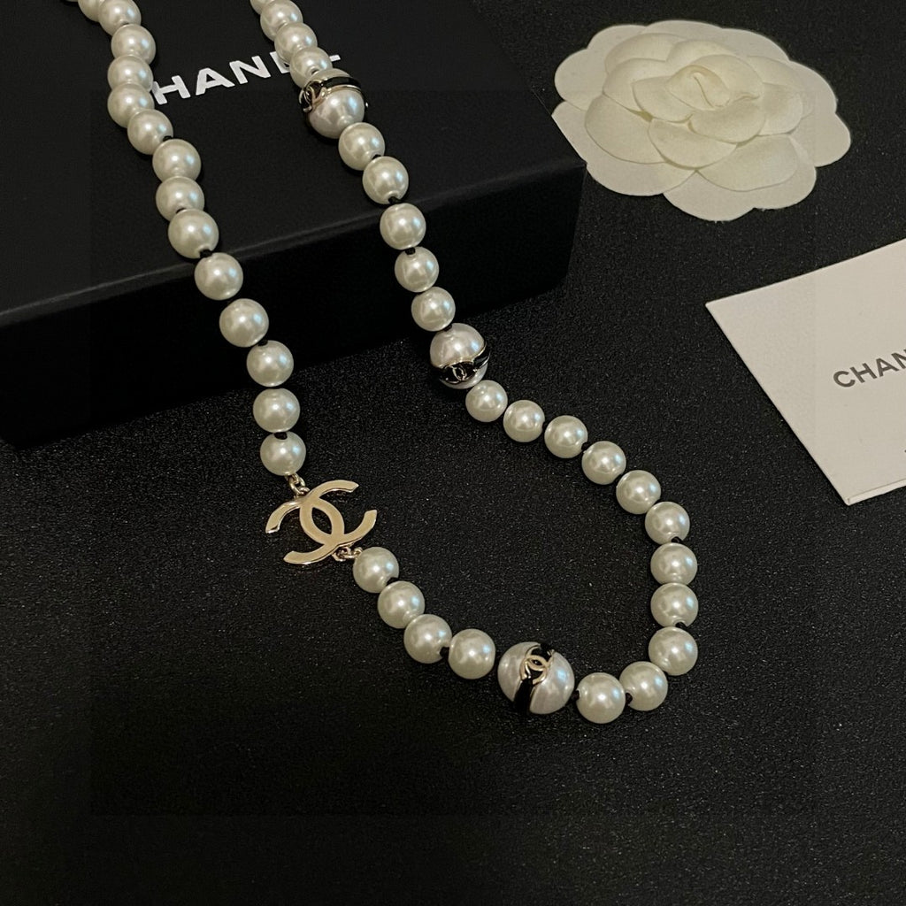 Double-C Emblem Pearl-Detail Pendant Necklace – Pearl Detail – Design 100 close-up detail