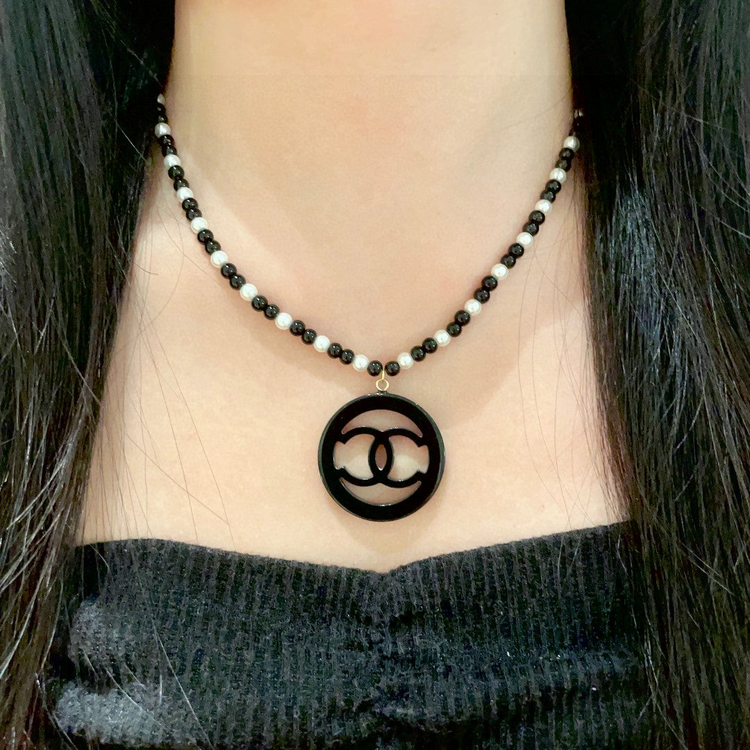 Double-C Emblem Pearl-Detail Pendant Necklace – Pearl Detail – Design 099 detail view
