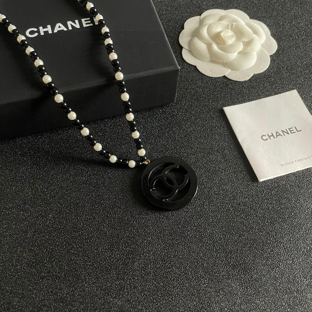Double-C Emblem Pearl-Detail Pendant Necklace – Pearl Detail – Design 099 styled product view