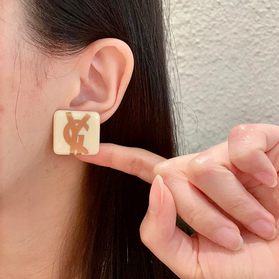 Letter Emblem Stud Earrings in Polished Metal-Tone – Design 004 front product view