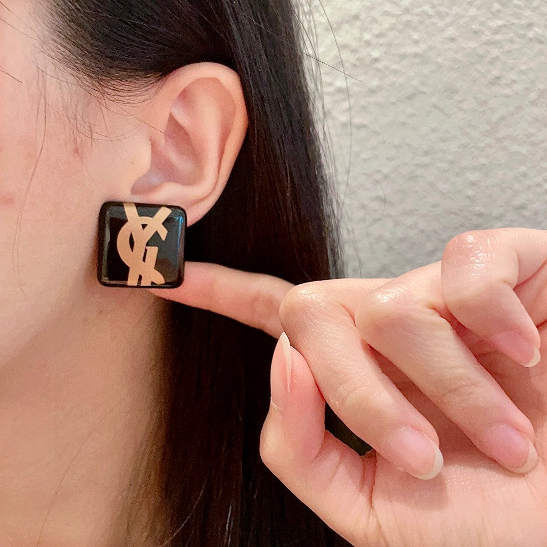 Letter Emblem Stud Earrings in Polished Metal-Tone – Design 014 front product view