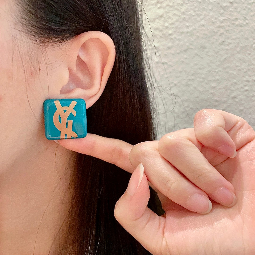 Letter Emblem Stud Earrings in Polished Metal-Tone – Design 016 front product view