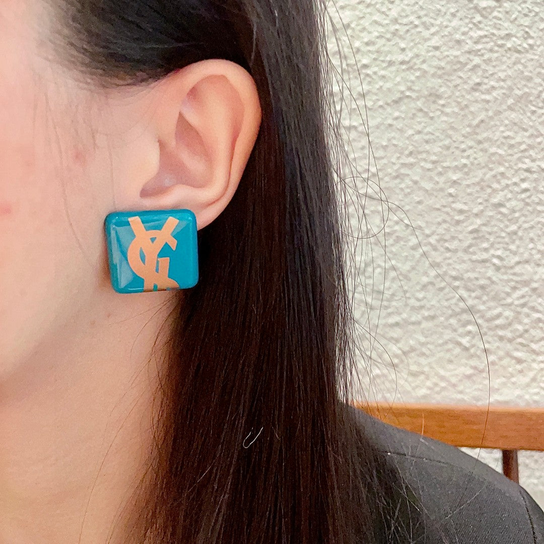 Letter Emblem Stud Earrings in Polished Metal-Tone – Design 016 detail view