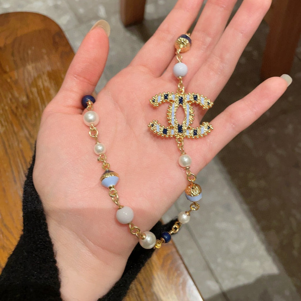 Double-C Emblem Pearl-Detail Pendant Necklace – Pearl Detail – Design 093 styled product view