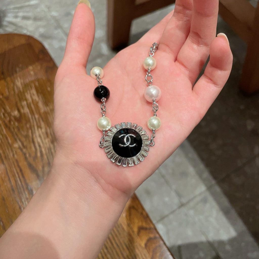 Double-C Emblem Pearl-Detail Pendant Necklace – Pearl Detail – Design 104 side detail