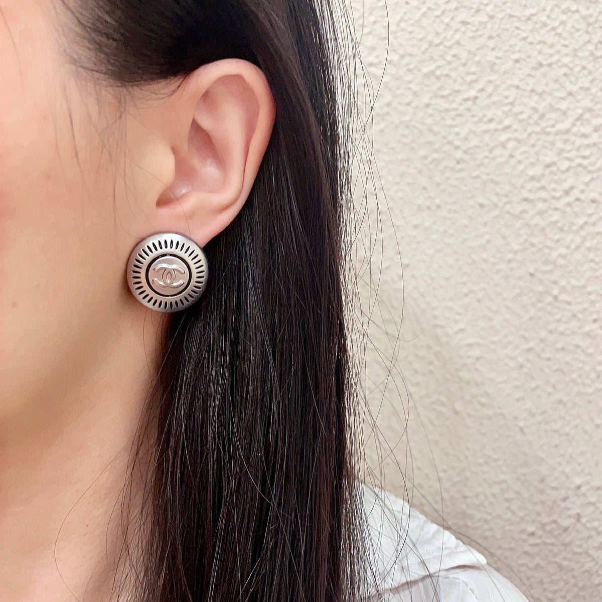 Double-C Emblem Stud Earrings in Polished Metal-Tone – Design 116 detail view