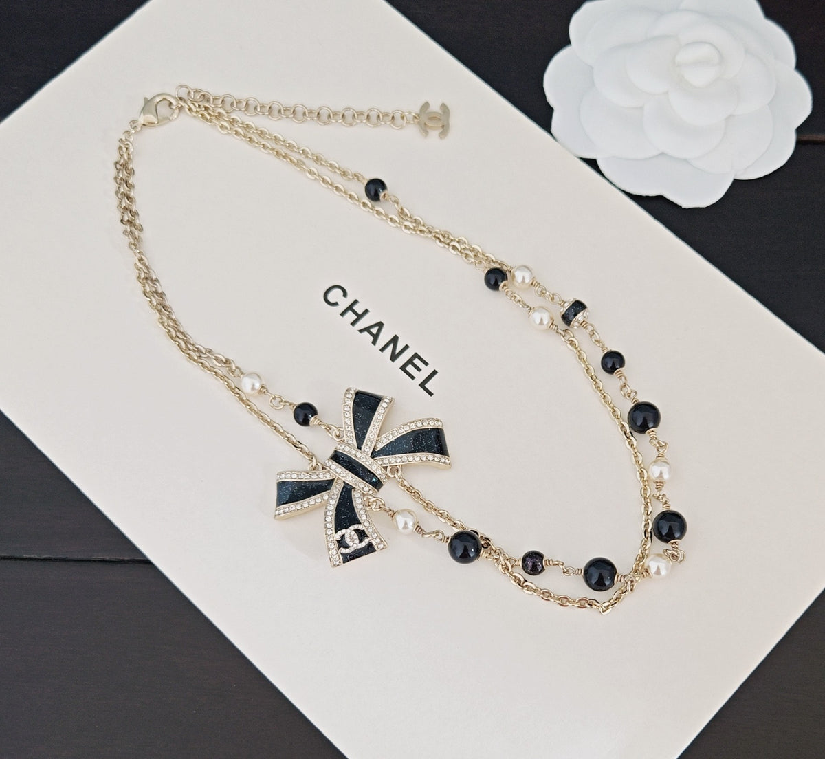 Bow Pendant Necklace in Gold-Tone – Black Detail close-up detail
